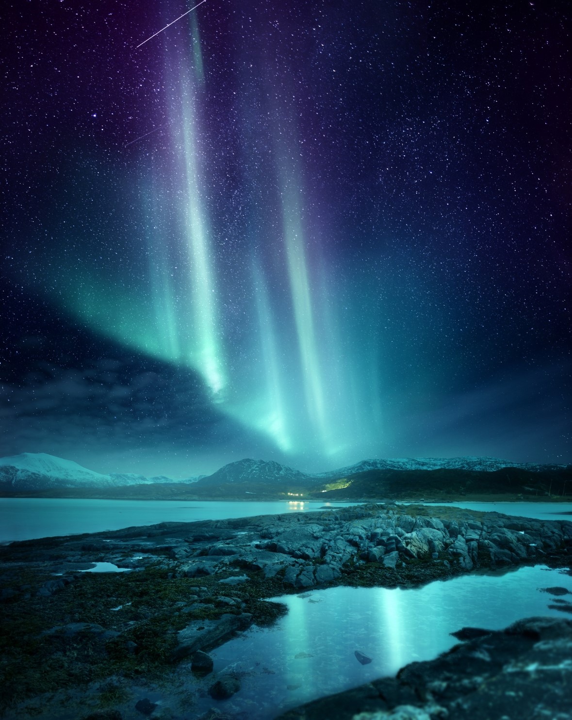 The northern lights at night above a lake
